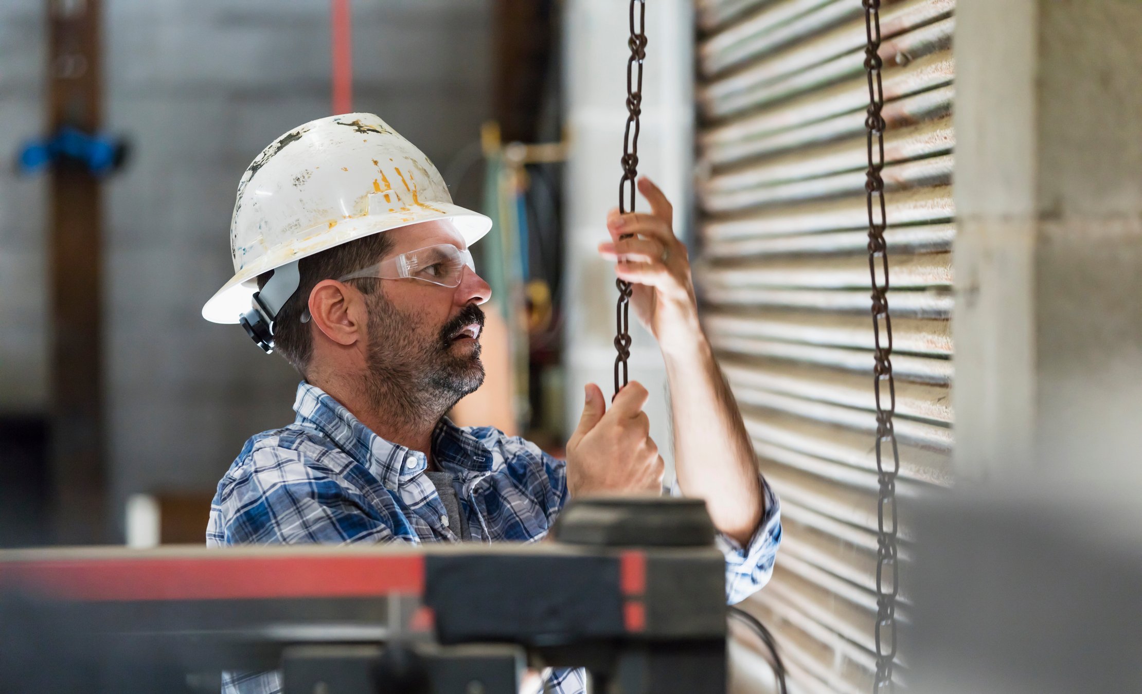 Man opening warehouse loading dock door