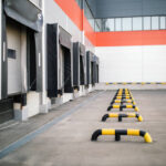Warehouse exterior, featuring loading bays